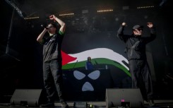 Northern Ireland hip-hop trio Kneecap perform on stage at a music festival outside Paris