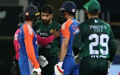 Pakistan's Haris Rauf (3R) shares words with India's Abhishek Sharma (L) during his side's Super Four loss to India on September 21