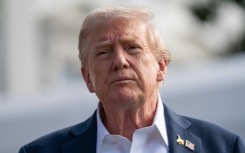 US President Donald Trump speaks to the press before boarding Marine One as he departs from the South Lawn of the White House in Washington, DC, on September 26, 2025, en route to attend the Ryder Cup.