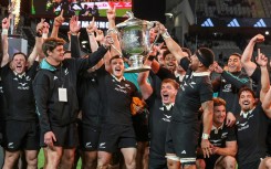 New Zealand celebrate with the Bledisloe Cup after beating Australia at Eden Park in Auckland