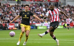 Brentford's Igor Thiago (R) shoots to score against Manchester United