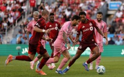 Inter Miami's Lionel Messi attempts to evade Toronto's Kosi Thompson in their 1-1 draw in Major League Soccer