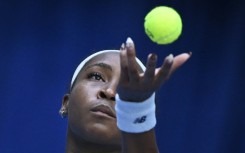Coco Gauff serves against Leylah Fernandez in Beijing