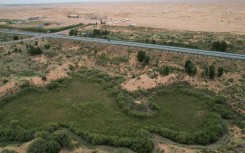 The green zone and the desert landscape in the Kubuqi Desert, in China's northern Inner Mongolia region