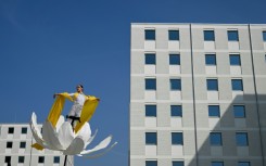 Artists perform in the Olympic and Paralympic Village of the 2026 Milano-Cortina Winter Olympics on the day of its official presentation