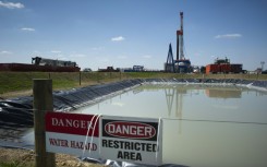 Fracking rigs like this one pictured in the United States inject water and chemicals into rock formations deep underground to release oil and gas