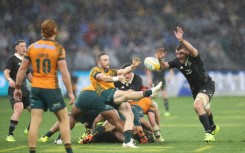 New Zealand defeated Australia 28-14 in wet conditions in Perth to keep their Rugby Championship title hopes alive