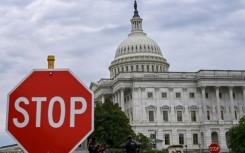 A stop sign is seen in front of the US Capitol -- where talks to repoen the federal government have seen little progress