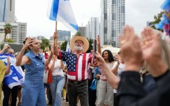 People waved Israeli and US flags in Tel Aviv's Hostages Square