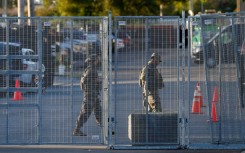 National Guard troops are seen near an entrance to a US Immigration and Customs Enforcement (ICE) detention facility in Broadview, Illinois