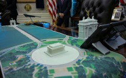 A plan for an arch across from the Lincoln Memorial is seen on the Resolute Desk as US President Donald Trump meets with Finnish President Alexander Stubb and Prime Minister Petteri Orpo in the Oval Office of the White House in Washington, DC, on October 9, 2025.