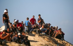 Displaced Palestinian civilians were at first nervous to return to their homes as Israeli forces beagn a ceasefire, but a trickle soon turned into a flood of people heading north to Gaza City