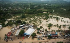 This aerial view taken during a Mexican Navy flyover shows flooded streets after heavy rains in Poza Rica, in Veracruz state