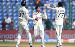 India's Kuldeep Yadav (centre) celebrates after taking the wicket of the West Indies' Justin Greaves
