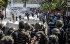 Protesters clash with members of the Malagasy gendarmerie as thousands gather during protests calling for the resignation of President Rajoelina in Antananarivo, on October 11, 2025
