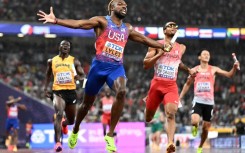 Noah Lyles (C) anchored the USA 4x100 metre relay team to gold at the World Athletics Championships in Tokyo