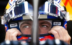 Red Bull Racing's Dutch driver Max Verstappen secures his helmet during practice for the United States Formula One Grand Prix at the Circuit of the Americas in Austin, Texas