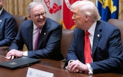 US President Donald Trump (R) speaks with Australia's Prime Minister Anthony Albanese in the Cabinet Room at the White House