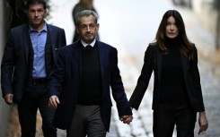 Sarkozy walked out of his home hand-in-hand with his wife singer Carla Bruni