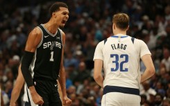 Victor Wembanyama (L) is officially listed this season at 7 feet 4 inches -- about 2.24 meters -- making him the tallest player in the league, tied with Memphis center Zach Edey