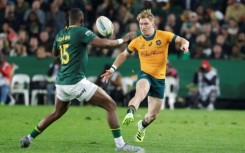 Australia's loose forward Nick Champion de Crespigny (R) in action against South Africa