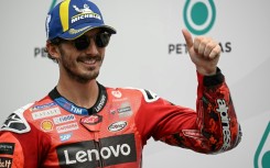 Italian MotoGP rider Francesco Bagnaia celebrates coming first in qualifying