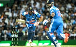 India's Rohit Sharma (L) and Virat Kohli run between the wicket during the third one-day international against Australia