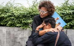 Mourners gathered outside a hospital in Bangkok after the death of former Queen Sirikit, aged 93, was announced. The royal familiy is revered in Thailand
