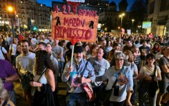 Demonstrators, many carrying photos of the victims, called for regional leader Carlos Mazon to resign