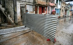 Residents prepare for the arrival of Hurricane Melissa in the Cuban city of Santiago de Cuba, on October 28, 2025