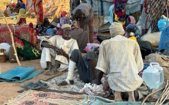 Displaced Sudanese who fled El-Fasher after the city fell to the Rapid Support Forces (RSF), rest near the town of Tawila in war-torn Sudan's western Darfur region