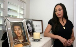 Megan Garcia stands next to a picture of her late son, Sewell Setzer III. The 14-year-old had fallen in love with a 'Game of Thrones' -inspired chatbot from Character.AI