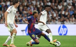 Vinicius Junior and Lamine Yamal fight for the ball during last weekend's Clasico, in which Real Madrid beat Barcelona 2-1