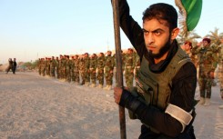A member of the Iraqi Shiite Muslim Mehdi Army, which also fought in Syria's civil war