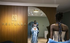 A model tries on an outfit from Nigerian brand Hertunba during a fitting session in Lagos