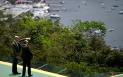 Britain's Prince William met with Rio de Janeiro's mayor Eduardo Paes a week after a horrific clash between police and gangs that killed 121 people