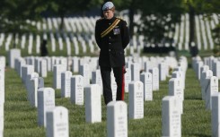Prince Harry visited a section of Arlington National Cemetery in Virginia in May 2013 where veterans of the wars in Iraq and Afghanistan are buried