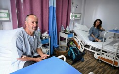 Avalanche survivors Didier Armand Berton (L) and Isabelle Thaon in a Kathmandu hospital