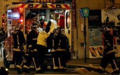 Emergency teams cared for victims of the deadly jihadist attacks near the Belle Equipe restaurant in Paris