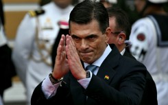 Bolivia's Rodrigo Paz gestures as he prepares to be sworn in as president in La Paz