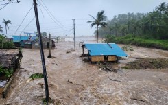Houses in the Philippines Catanduanes province were swamped by surging floodwaters from Typhoon Fung-wong
