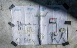 A drawing created by a young Sudanese refugee is at the Tine transit camp in Chad