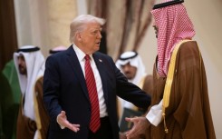 Trump (L) met Saudi Crown Prince Mohammed bin Salman in Riyadh in May