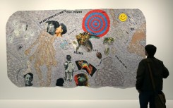 A person looks at a piece by US artist Howardena Pindell entitled 'Autobiography: Scapegoat' at the Studio Museum in Harlem in New York