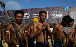 Members of the Indigenous movement Munduruku Ipereg Ayu hold a protest outside the United Nations climate summit venue in Belem, Brazil