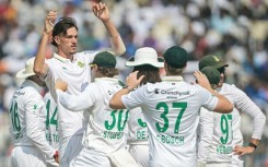 South Africa's Marco Jansen celebrates with teammates after taking the wicket of India's KL Rahul