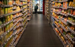 File: A customer looking at a fridge in a store. AFP/Joel Saget
