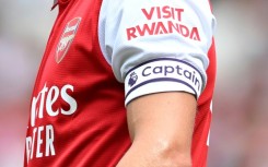 The Visit Rwanda logo on the sleeve of Arsenal player Martin Odegaard in 2022