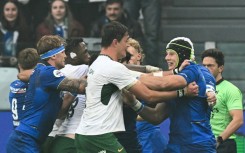South Afria lock (C) Franco Mostert grapples with Italy flanker Ross Vintcent during last Saturday's game