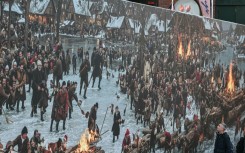 The display at first glance seems to depict a jolly crowd enjoying the festive season